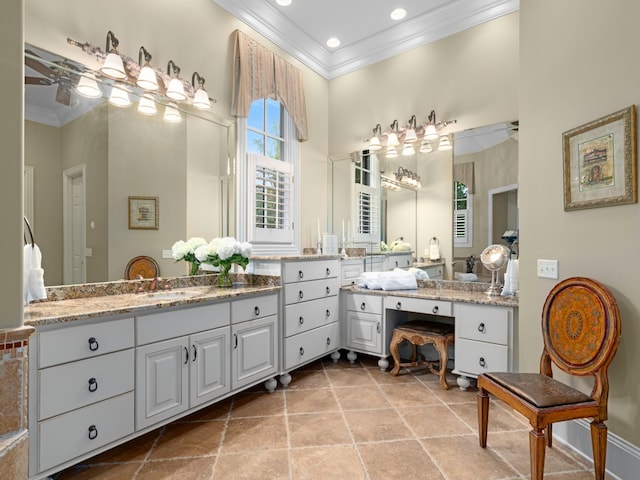 bathroom with vanity and ornamental molding