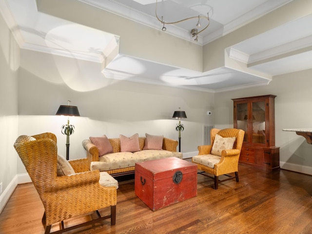 living room featuring hardwood / wood-style floors and ornamental molding