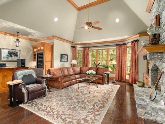 living room with ceiling fan, wine cooler, high vaulted ceiling, dark hardwood / wood-style floors, and a fireplace