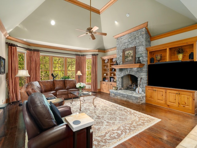 living room featuring ceiling fan, a stone fireplace, crown molding, and high vaulted ceiling