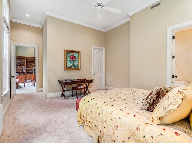 carpeted bedroom featuring ceiling fan, crown molding, and a closet