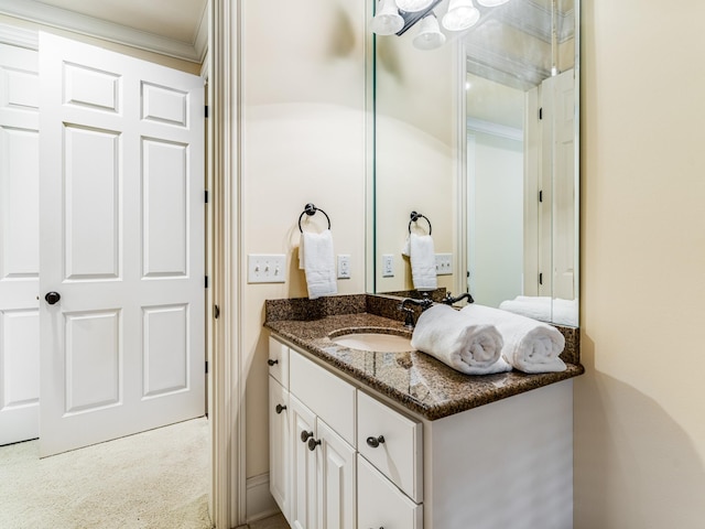 bathroom featuring vanity and ornamental molding