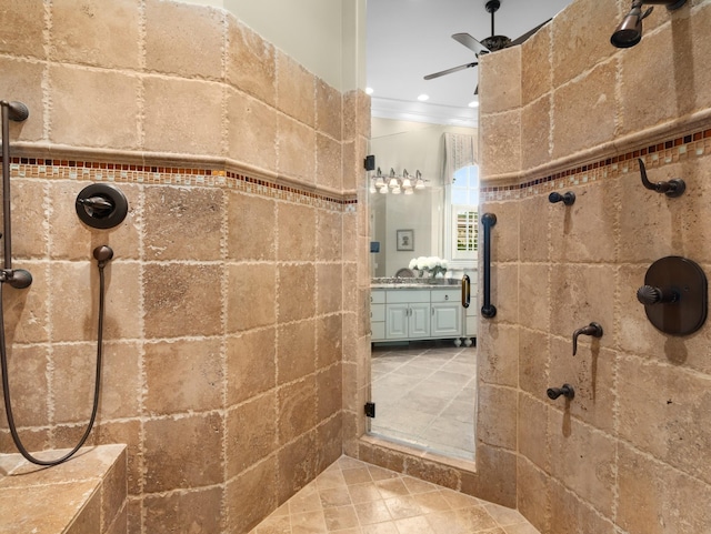 bathroom with vanity, a shower with door, and ornamental molding