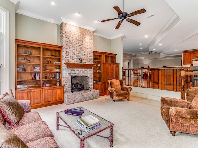 carpeted living room with ceiling fan, ornamental molding, and a brick fireplace