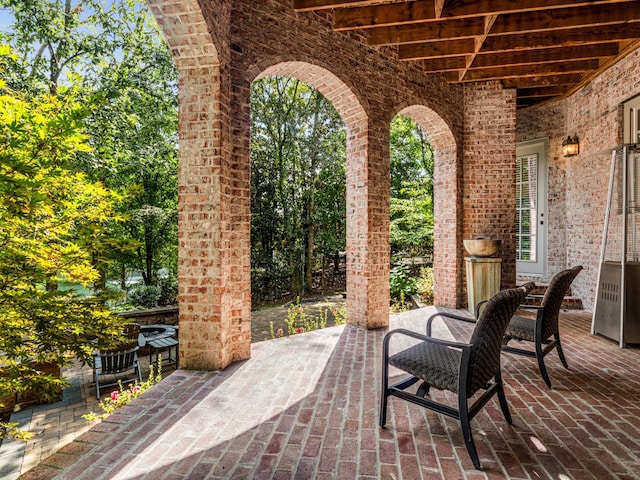 view of patio / terrace featuring an outdoor fireplace