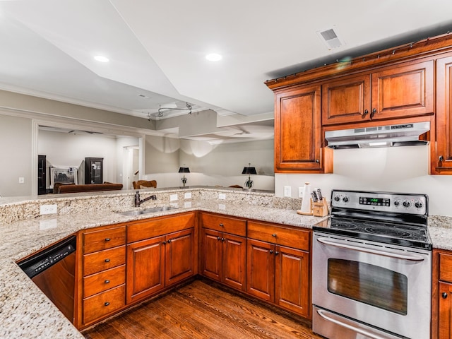 kitchen featuring stainless steel appliances, light stone counters, dark hardwood / wood-style floors, and sink