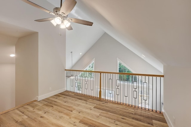 bonus room with ceiling fan, light hardwood / wood-style floors, and vaulted ceiling