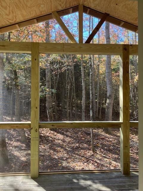 unfurnished sunroom with vaulted ceiling