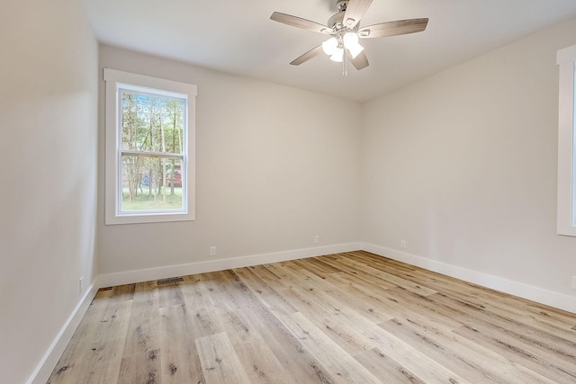 spare room featuring ceiling fan and light hardwood / wood-style flooring