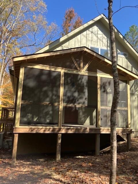 view of home's exterior with a sunroom