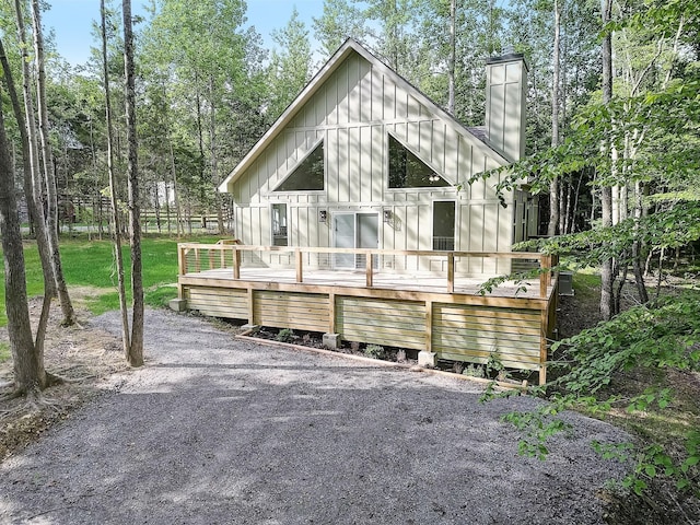 back of property featuring a wooden deck