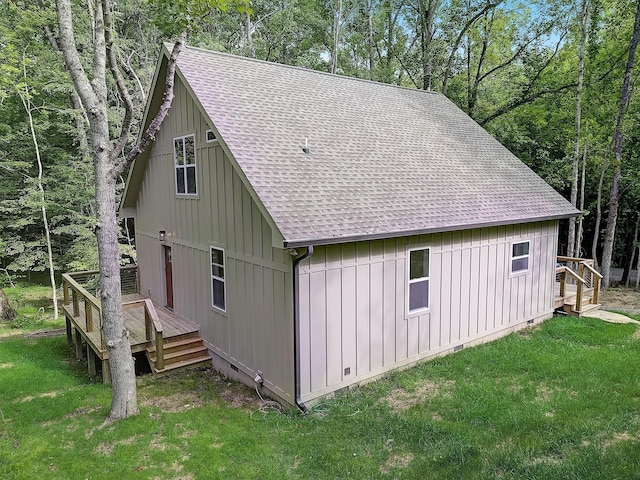 view of property exterior featuring a yard and a deck