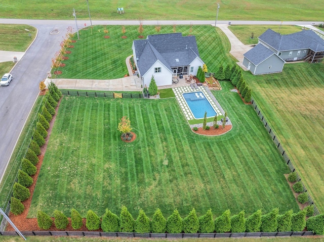 birds eye view of property with a rural view