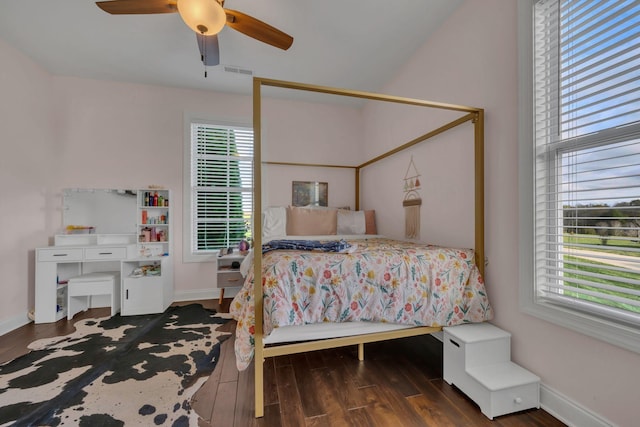 bedroom with ceiling fan and dark wood-type flooring