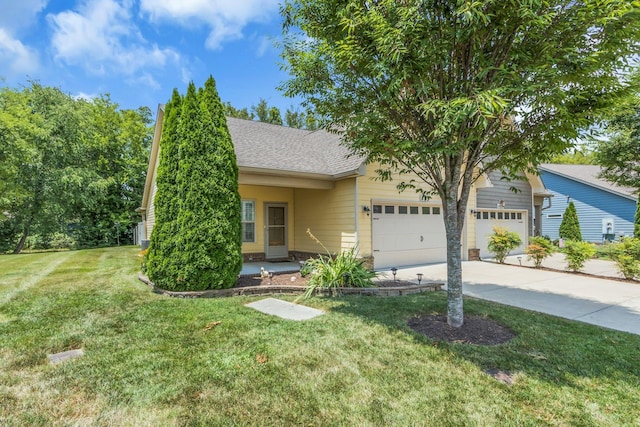 view of front of property featuring a garage and a front lawn