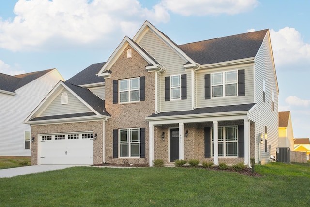 craftsman-style house with central AC unit, a garage, and a front lawn