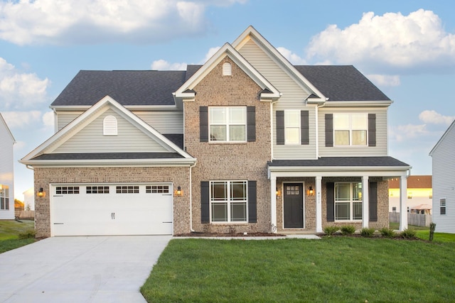 craftsman house featuring a garage and a front yard