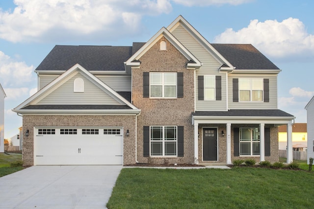 craftsman-style home with a garage and a front lawn