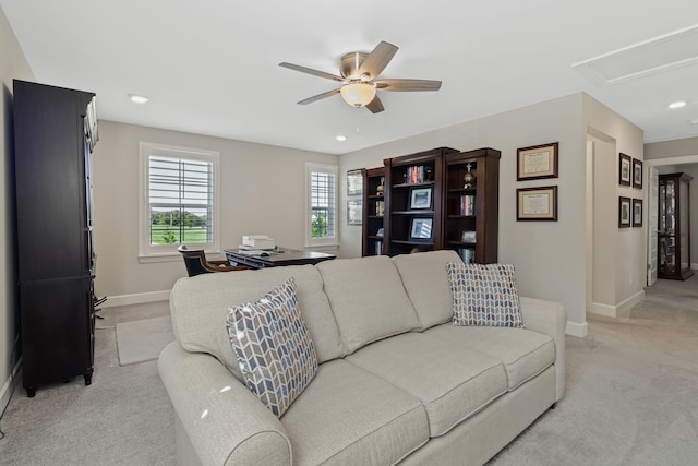 living room with light carpet and ceiling fan