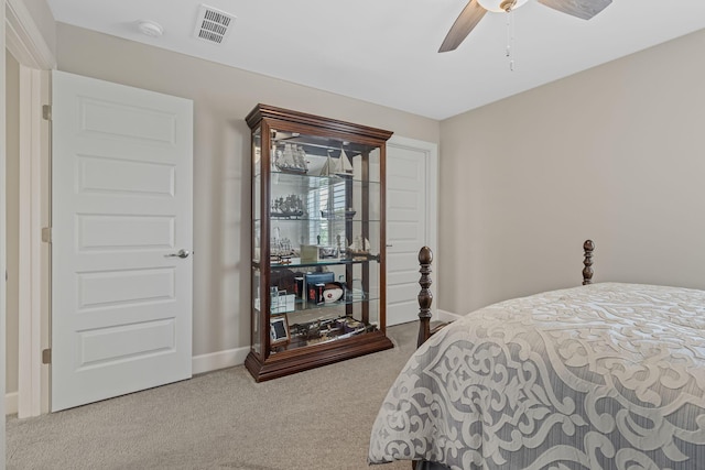 bedroom featuring ceiling fan and light carpet