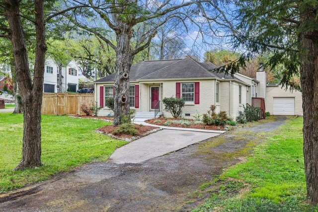 3417 Pleasant Valley Rd, Nashville, TN 37204 - ranch-style home with a front yard, an outbuilding, and a garage