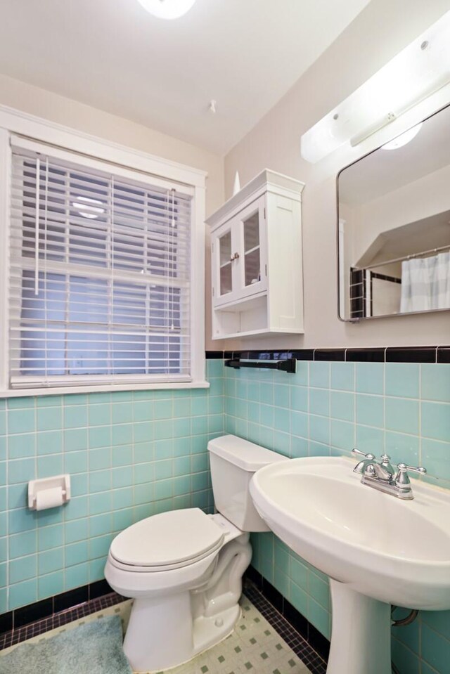 3417 Pleasant Valley Rd, Nashville, TN 37204 - bathroom with sink, tile patterned flooring, toilet, tile walls, and a shower with shower curtain