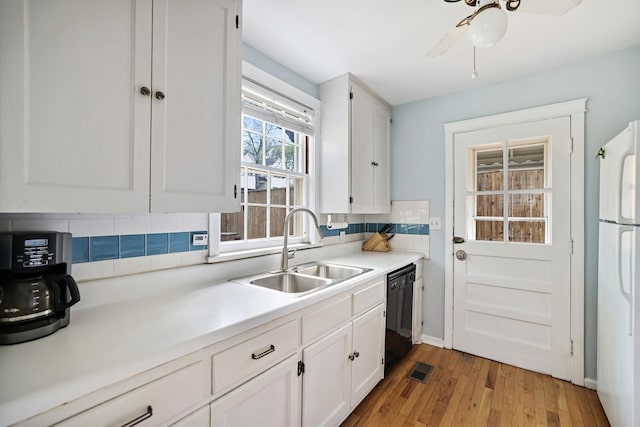 3417 Pleasant Valley Rd, Nashville, TN 37204 - kitchen featuring decorative backsplash, white cabinets, sink, white refrigerator, and dishwasher