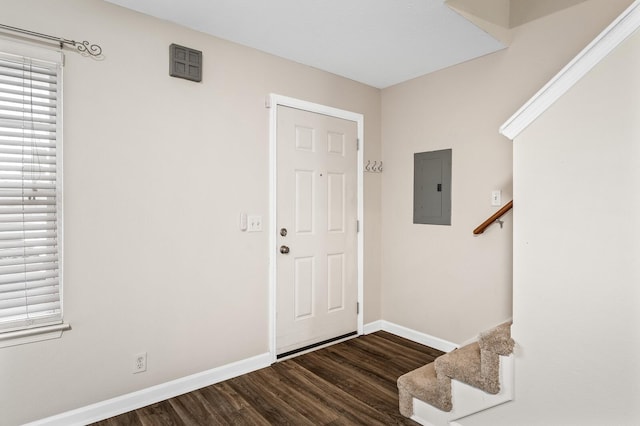 foyer with dark hardwood / wood-style flooring and electric panel