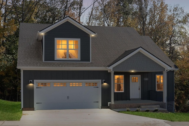 view of front of property with a garage and a porch