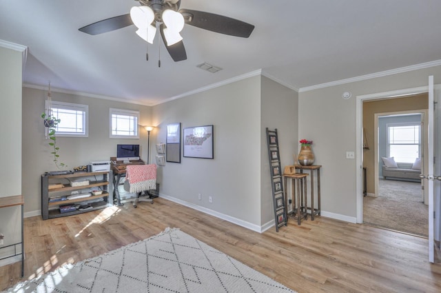 interior space featuring crown molding, ceiling fan, and light hardwood / wood-style floors