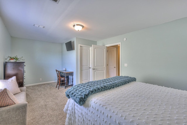 bedroom featuring light carpet