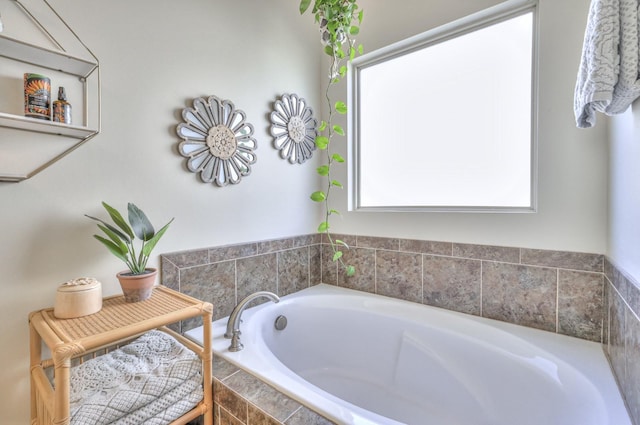 bathroom featuring tiled tub