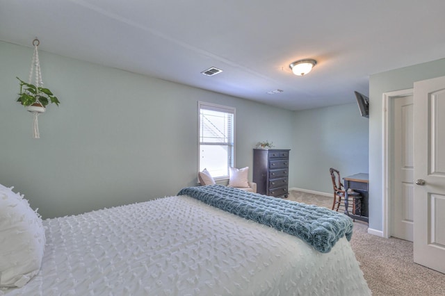 bedroom with light colored carpet