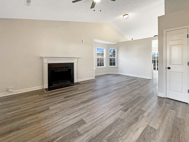 unfurnished living room featuring a textured ceiling, ceiling fan, lofted ceiling, and dark wood-type flooring