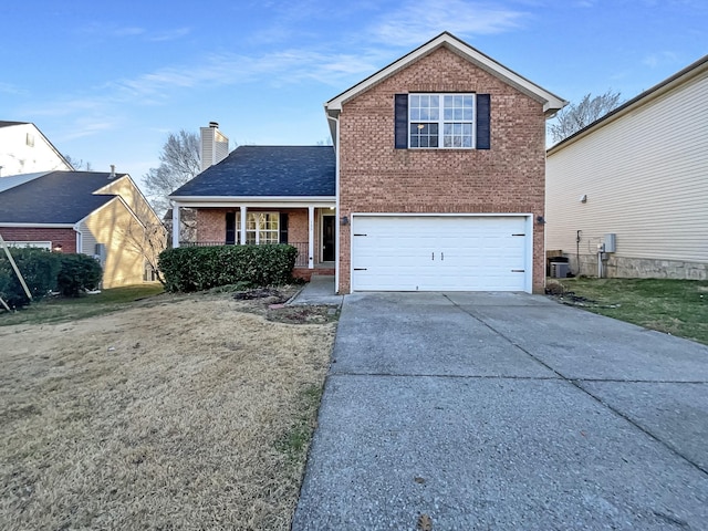 view of property featuring central AC, a garage, and a front lawn