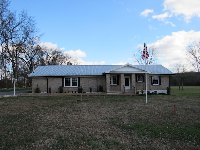 ranch-style home featuring a front yard