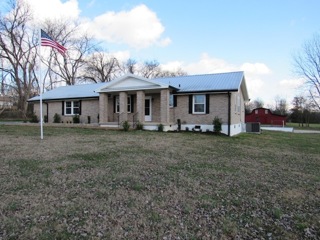 single story home with a front yard, a porch, and central AC