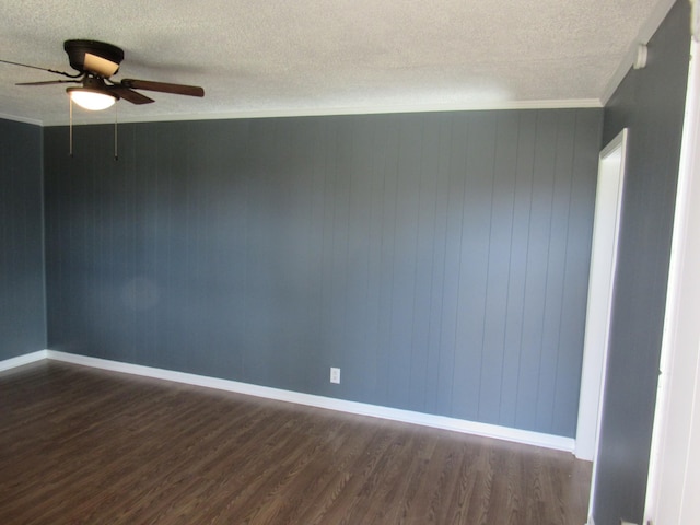 unfurnished room featuring a textured ceiling, dark hardwood / wood-style flooring, ceiling fan, and crown molding