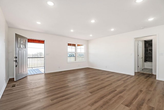 unfurnished room featuring dark hardwood / wood-style floors