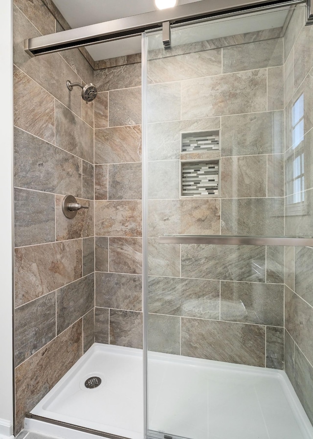 bathroom featuring an enclosed shower