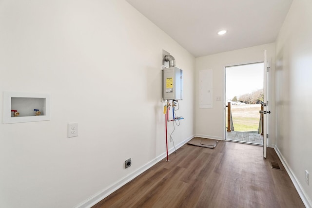 doorway featuring dark wood-type flooring and water heater