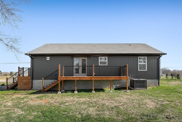 back of house featuring a yard, a deck, and central air condition unit