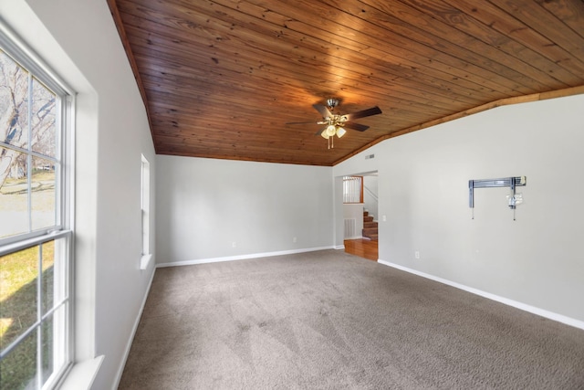 carpeted spare room with lofted ceiling, ceiling fan, and wood ceiling