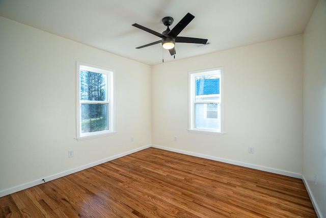 unfurnished room featuring wood-type flooring and ceiling fan