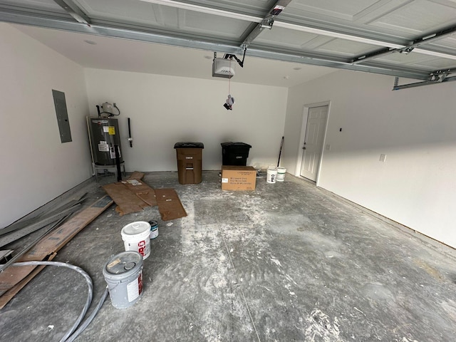 garage featuring electric panel, electric water heater, and a garage door opener