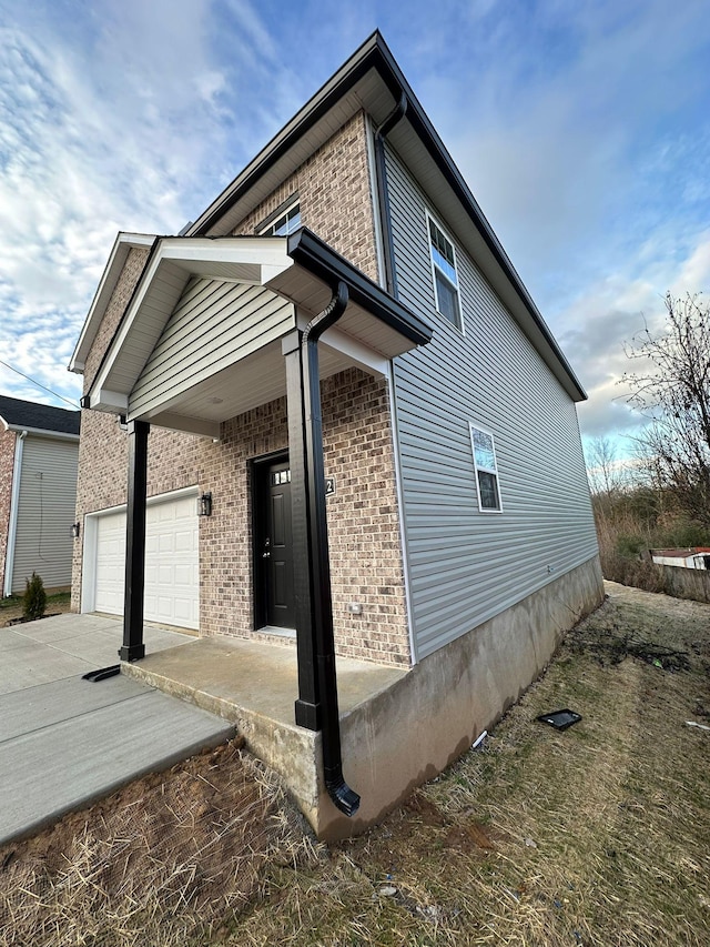 view of side of home with a garage