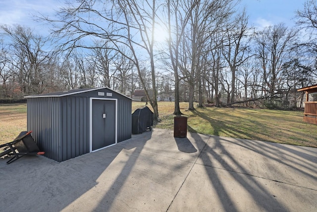 view of patio / terrace featuring area for grilling and a shed