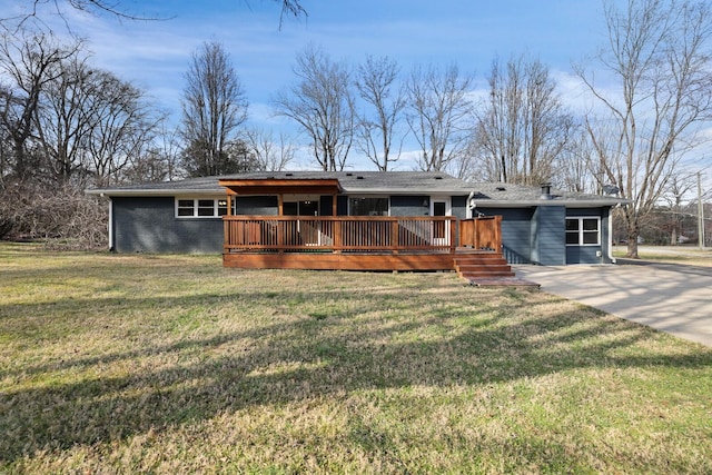 ranch-style house with a front yard and a deck