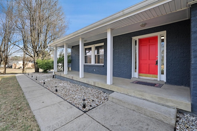 entrance to property featuring a porch