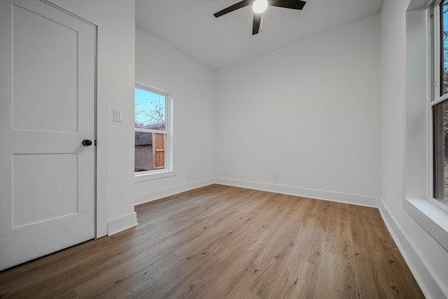 spare room with ceiling fan and light wood-type flooring